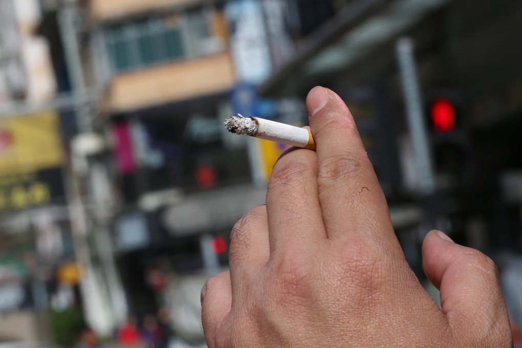 Ban smoking while walking on the street. Photo: David Wong