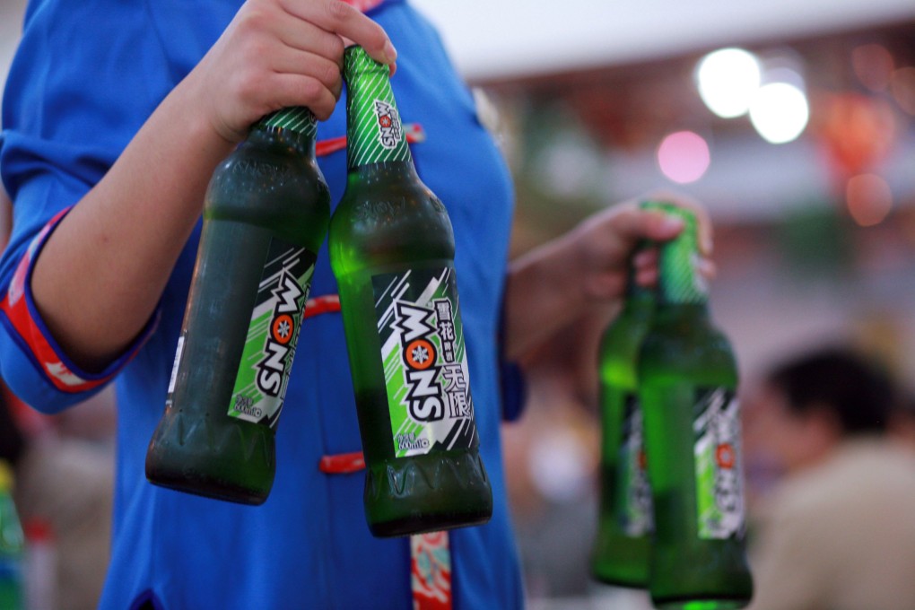 A waitress carries bottles of Snow Beer. Photo: Handout