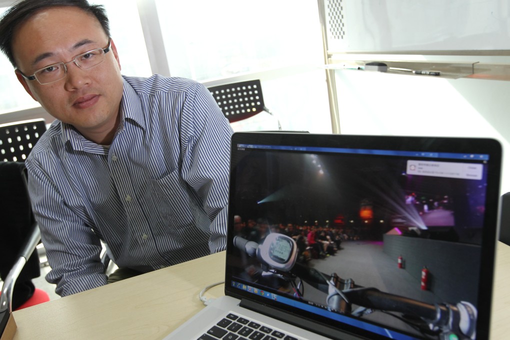 Yu Kai, head of Baidu's Institute of Deep Learning (IDL), demonstrates the smart bike project, DuBike, at the company's headquarters in Beijing. Photo: Simon Song