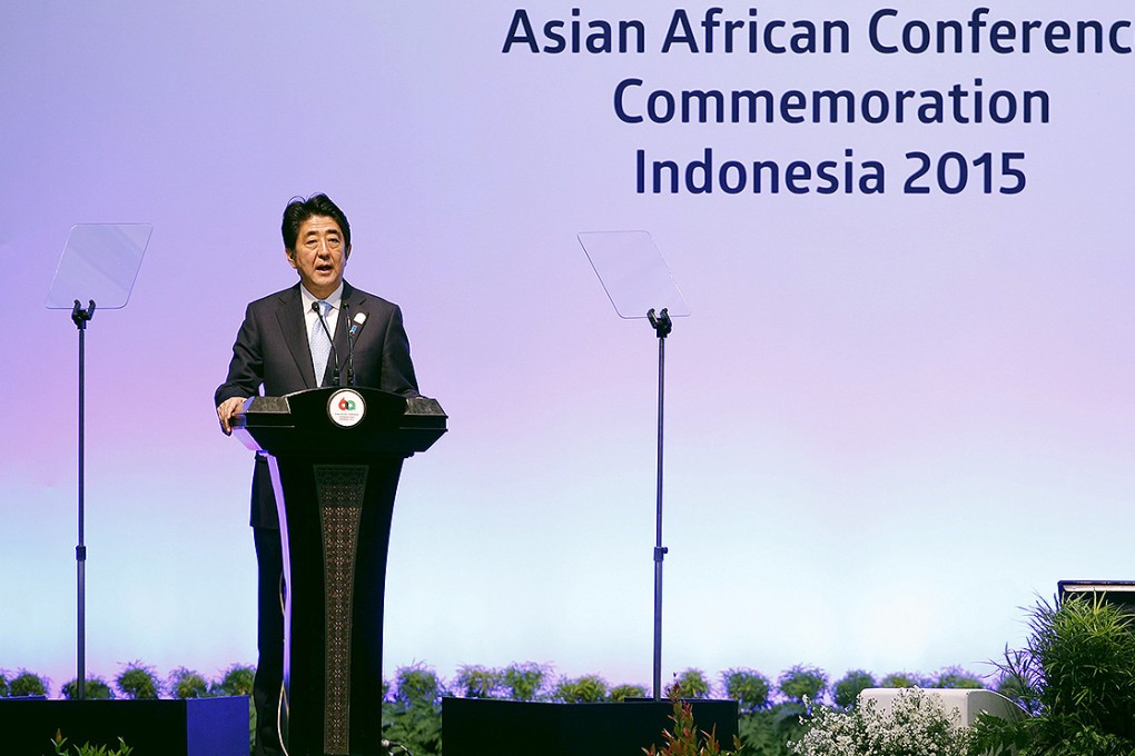 Abe delivers a speech at plenary session during the Asian African Conference in Jakarta. Photo: Reuters