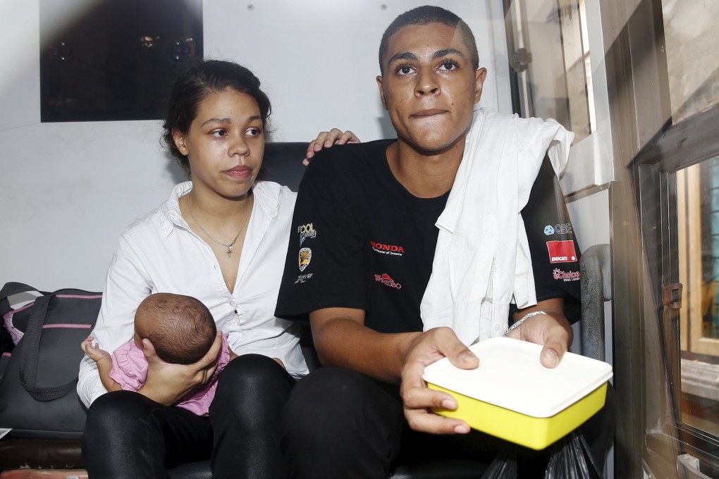Heather Mack and Tommy Schaefer sit in a prison bus before departing a Denpasar court, after receiving guilty verdicts in their murder trial on Tuesday on the Indonesian resort island of Bali. Photo: Reuters