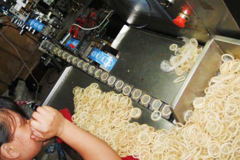 One of the machines producing fake condoms. Photo: Xinhua