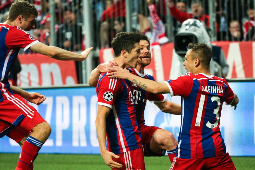 Bayern Munich's Robert Lewandowski (second from left) celebrates a goal with his teammates. Photo: Xinhua