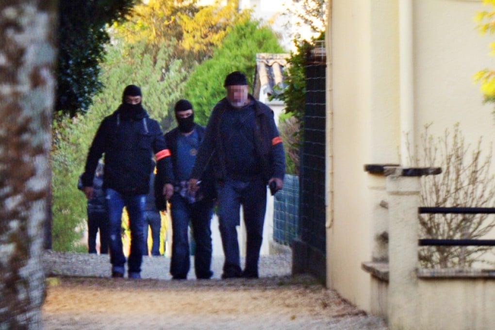 French policemen search the Vert-Bois neighbourhood in Saint-Dizier  where a Franco-Algerian student, allegedly planning a church attack in France, used to spend time with his family. Photo: AFP