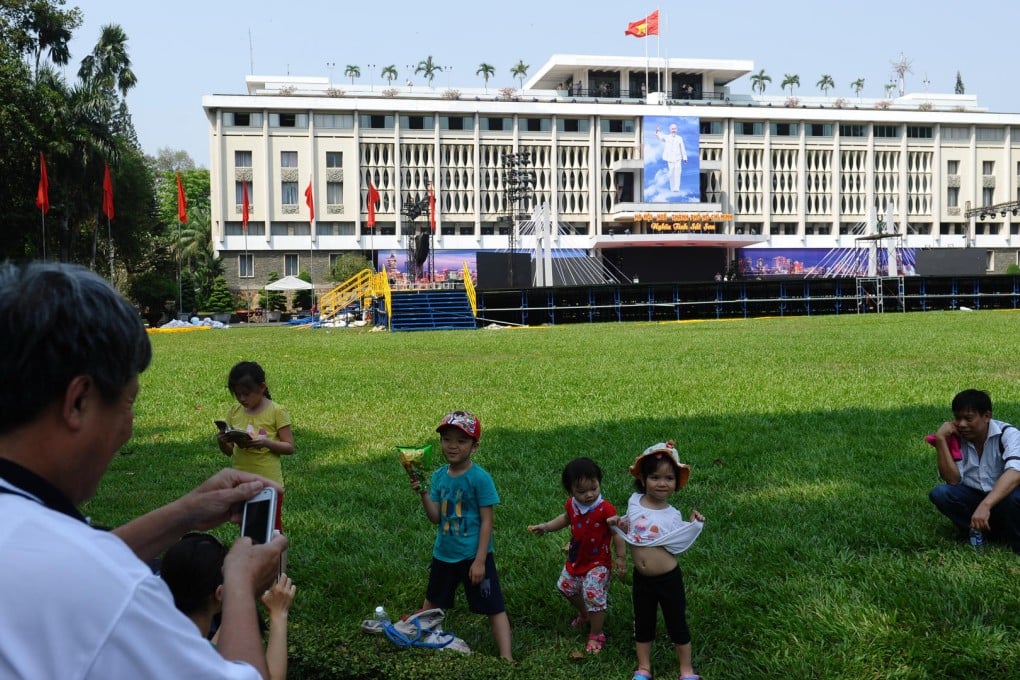 Tourists at the Reunification Palace. Photos: AFP; Keith Mundy