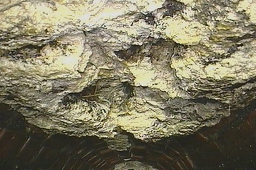 A photograph supplied by CountyClean and made available by the Thames Water Company shows a 15-tonne "fatberg" that was eventually removed from a sewer in Kingston upon Thames in 2013. Photo: EPA