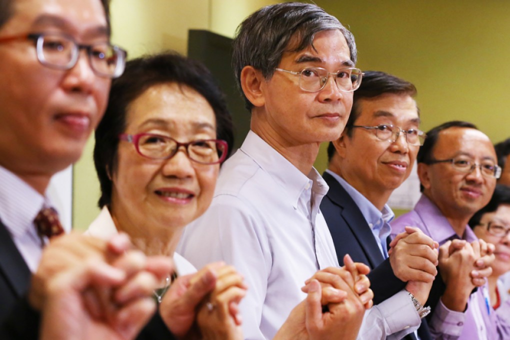 Chan Yuen-han (2nd left), legislator for the Federation of Trade Unions, at the signing of a joint statement to seek consensus for electing the Chief Executive by universal suffrage in August last year. Photo: Nora Tam