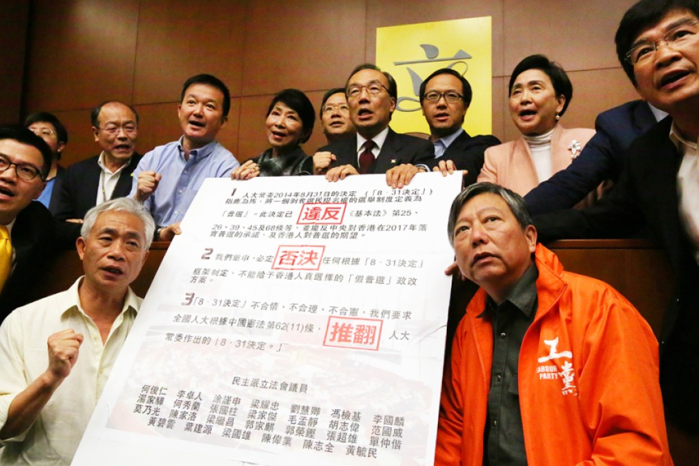 Pan-democrats sign joined declaration on the method for selecting the Chief Executive of Hong Kong by universal suffrage in March 2015, at the Legislative Council in Tamar. Photo: Felix Wong