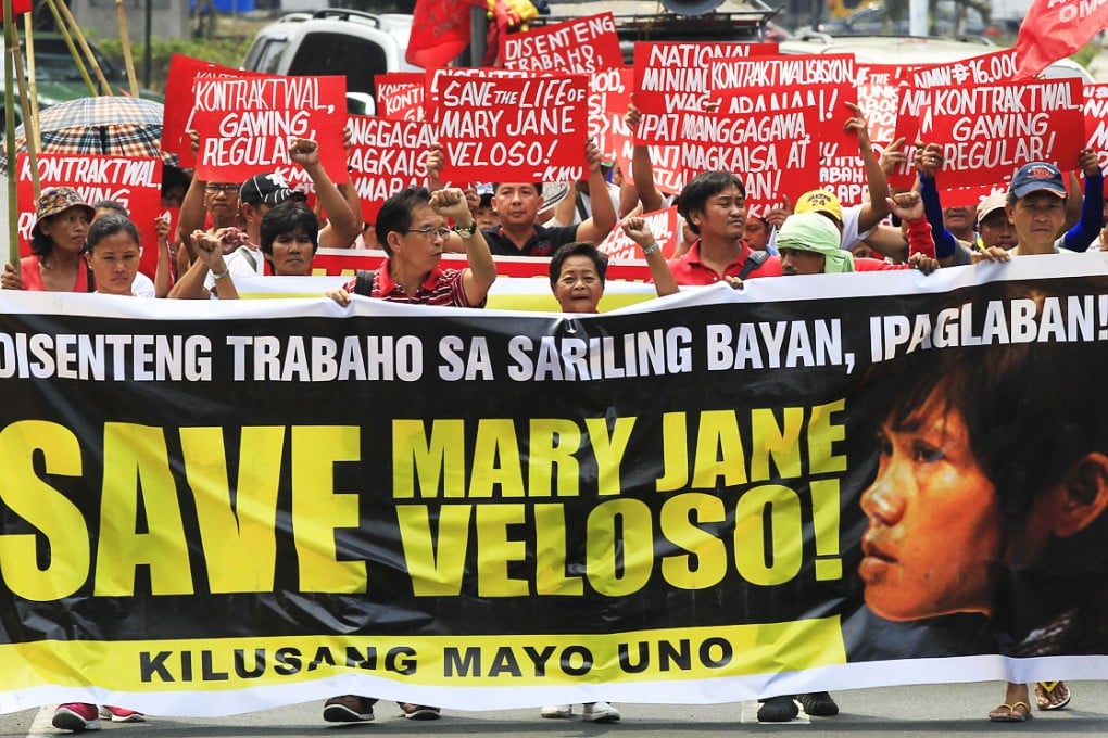 Migrant rights activists urge the Philippine government to save Mary Jane Veloso. Photo: Reuters