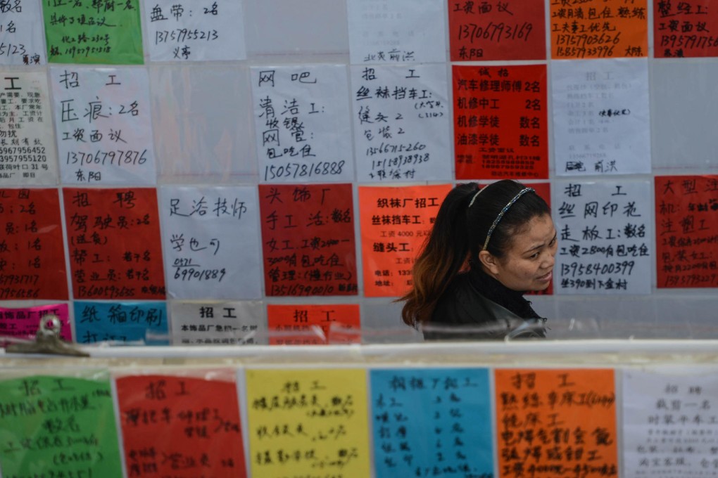 A woman at a job fair in Yiwu in Zhejiang. China has seen a rare twin slide in growth and a shortage in the labour force, an analyst says. Photo: Xinhua