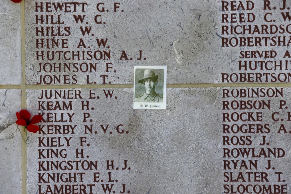 A flower and a picture sit next to the names of Australian soldiers who lost their lives during the Gallipoli campaign.Photo: Reuters