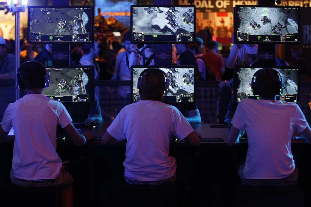 Gamers play Starcraft at an industry trade show in Germany. New technology uses online strategy games to transmit data and bypass censorship tools. Photo: Reuters
