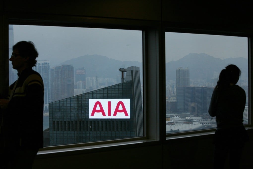 The AIA logo could be seen through the window of a building in Hong Kong. Photo: Reuters