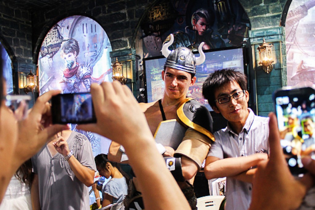 Gaming fans pose for photos at a convention in Shanghai. China had 383 million mobile gamers last year. Photo: SCMP Pictures