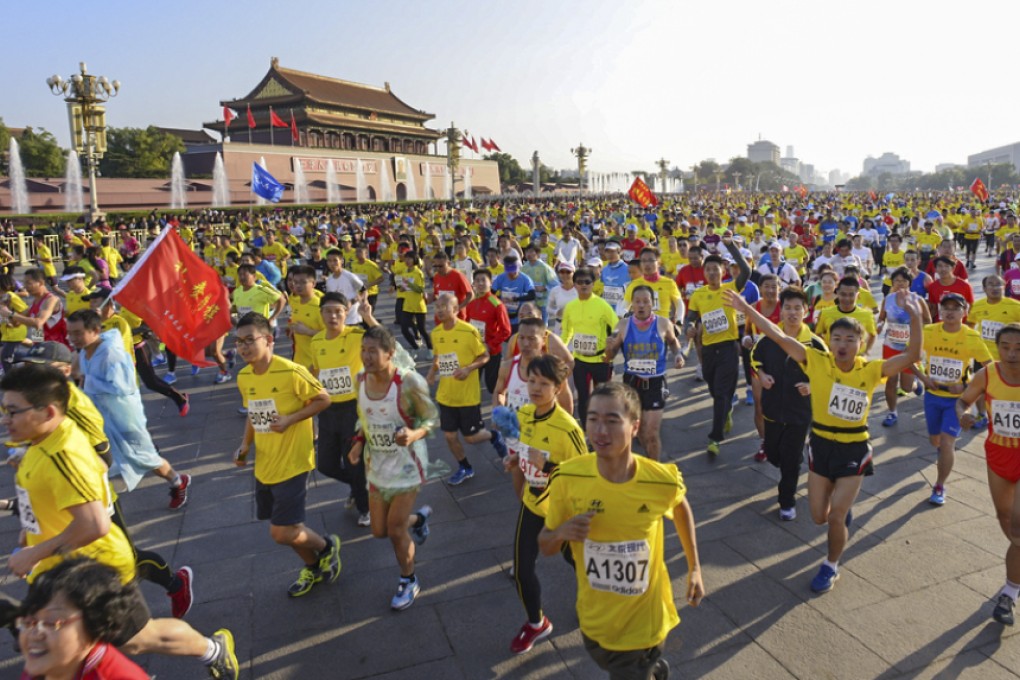 Runners tackle the Beijing marathon. Photo: SCMP Pictures
