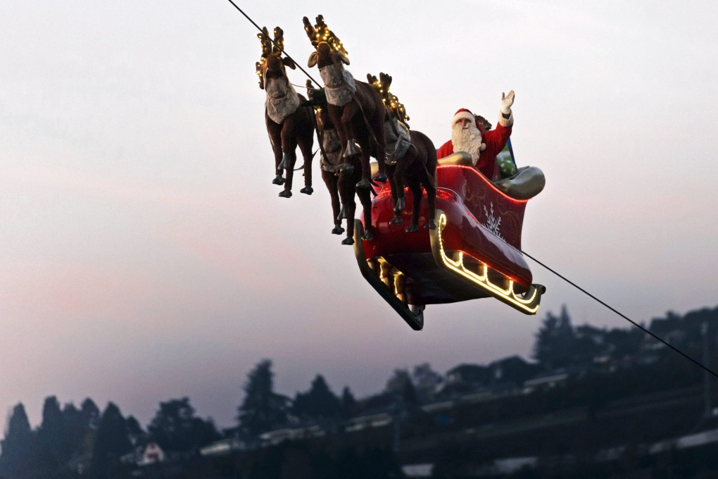 Santa waves to the crow during the Christmas celebration in Montreux, Switzerland, where the top hotel management schools in the world are located. Photo: EPA