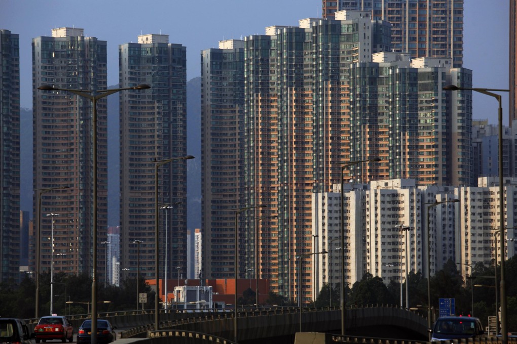 Light shines on a column of high-rise residential towers at sunset in Hong Kong. Photo: Reuters