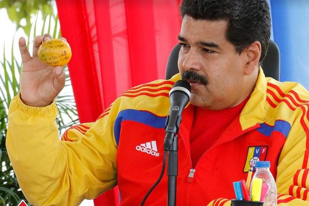 President Nicolas Maduro displays his mango with a message. Photo: www.nicolasmaduro.org.ve