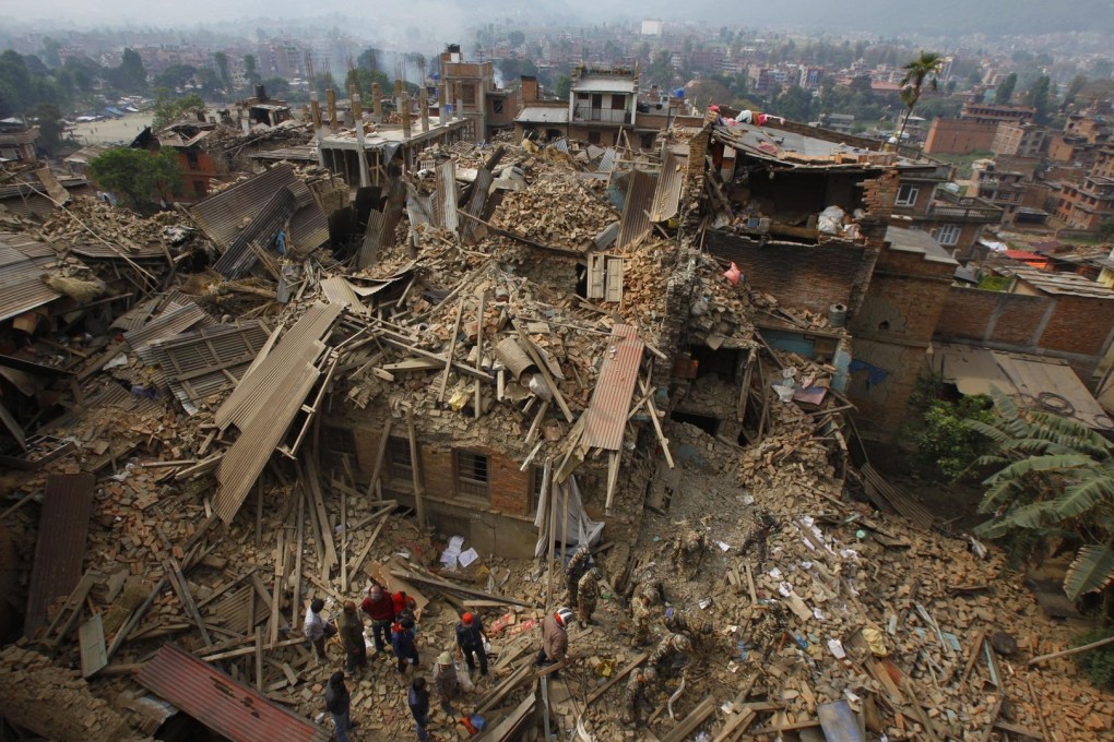 Rescuers search the rubble in Bhaktapur, near Kathmandu, in the aftermath of the 7.8-magnitude disaster. Photos: AP, AFP, Reuters, Xinhua