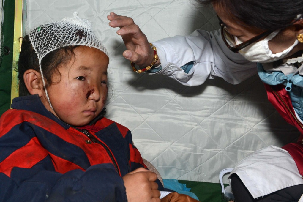 A child is treated at a hospital in Nyalam county in Xigaze near the Tibetan-Nepalese border. Four people are missing and 55 injured in the area. Photo: Xinhua