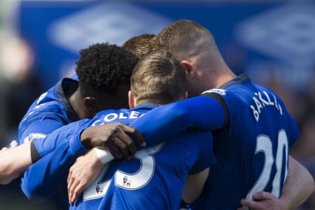 Everton players celebrate their opening goal against Manchester United at Goodison Park. Photo: AP