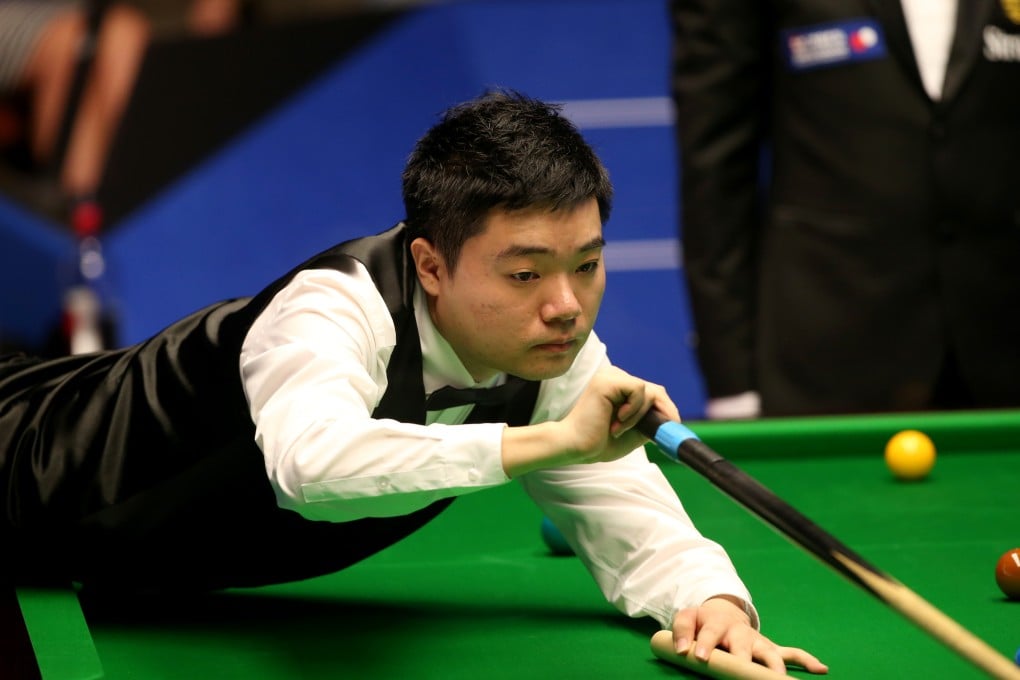Ding in action against John Higgins on his way to the last eight. Photo: Xinhua