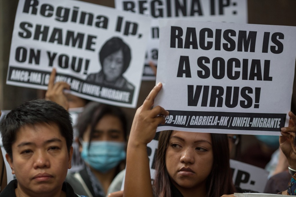 Protesters outside the offices of Regina Ip, chair of the New People's Party, over remarks she made that Filipino domestic helpers have become a sexual resource for foreign men in Hong Kong. Photo: EPA