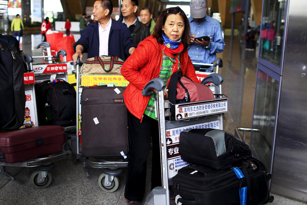 Chinese tourists who managed to get a flight out of Nepal arrive in Kunming in southwest China. Photo: Reuters