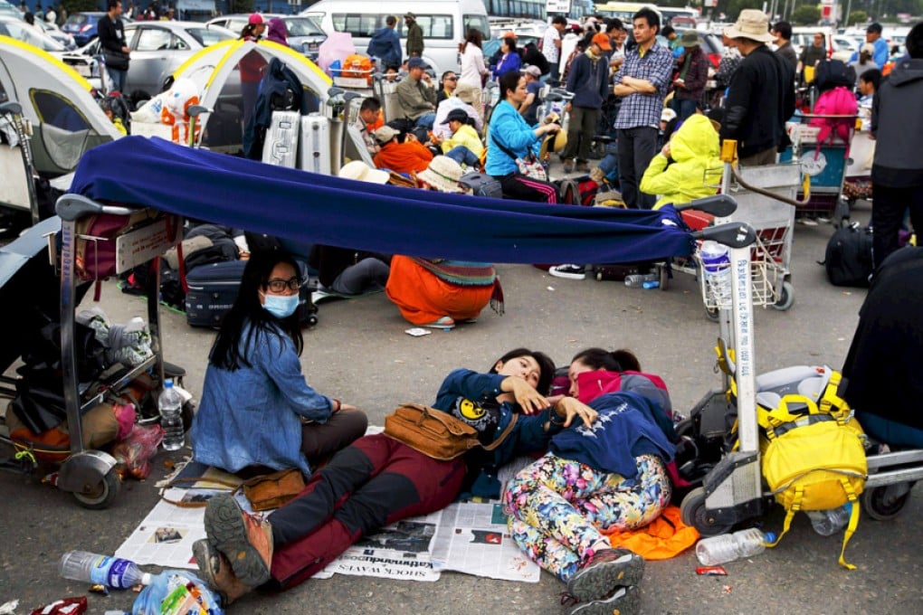 Chinese nationals gather outside the Kathmandu international airport. Photo: Reuters