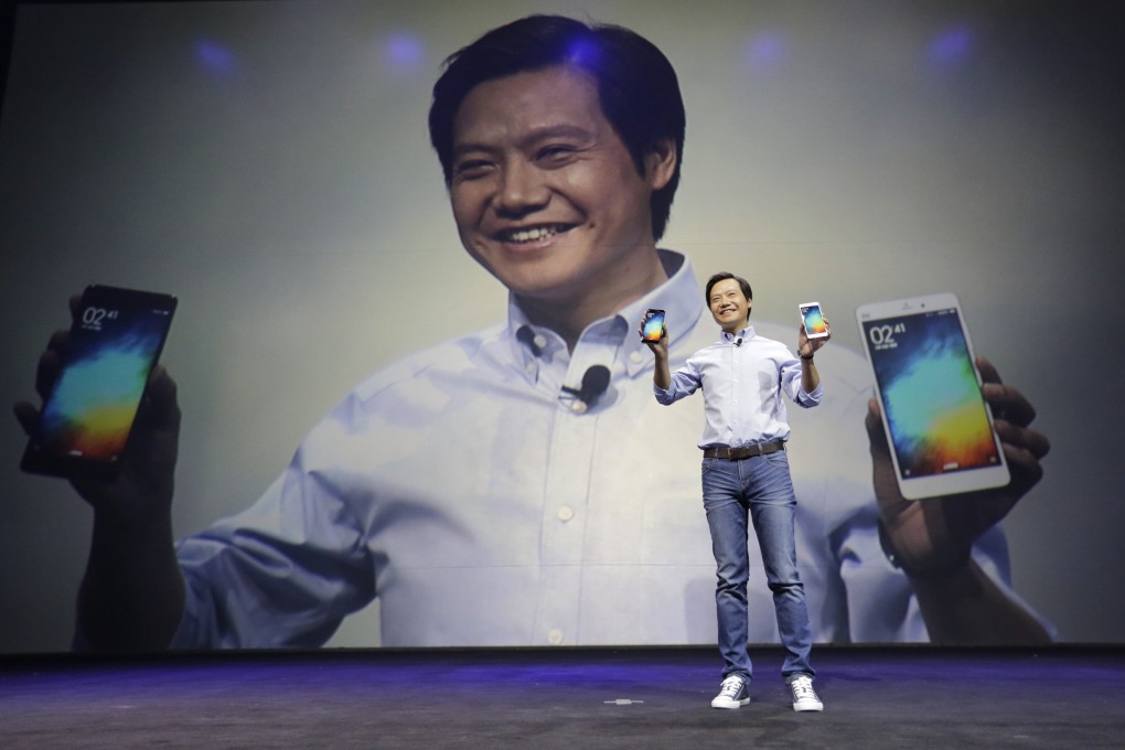 Xiaomi co-founder Lei Jun presents a new phone "Apple style", but the company eschews the big spending on marketing of its US rival. Photo: Reuters.