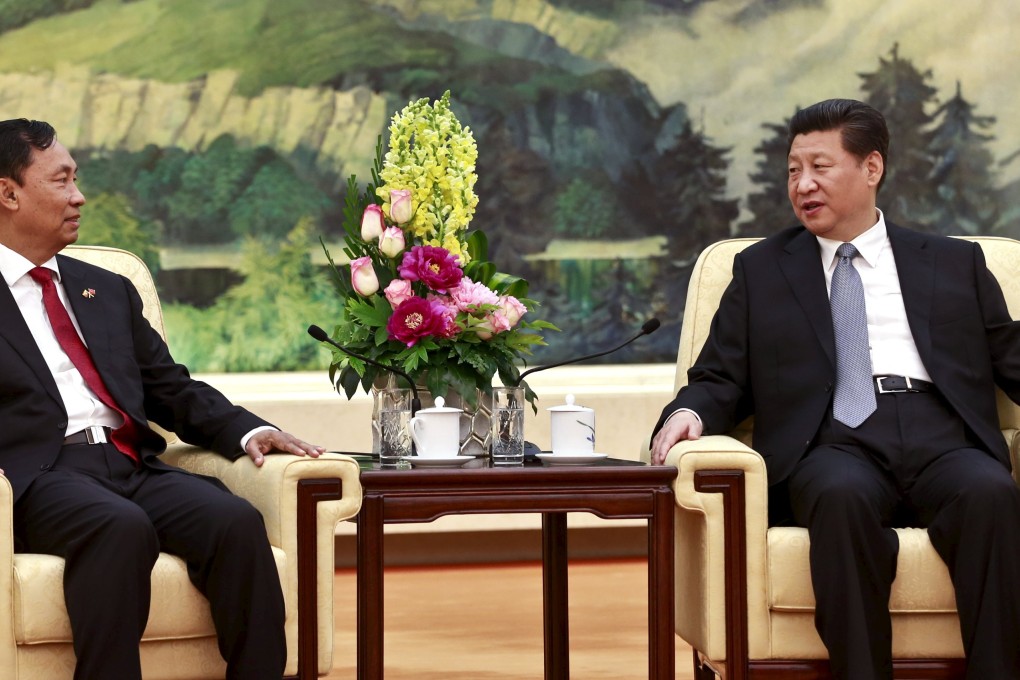 China's President Xi Jinping talks with speaker of Myanmar's Lower House of Parliament Shwe Mann, during their meeting in Beijing. Photo: Reuters