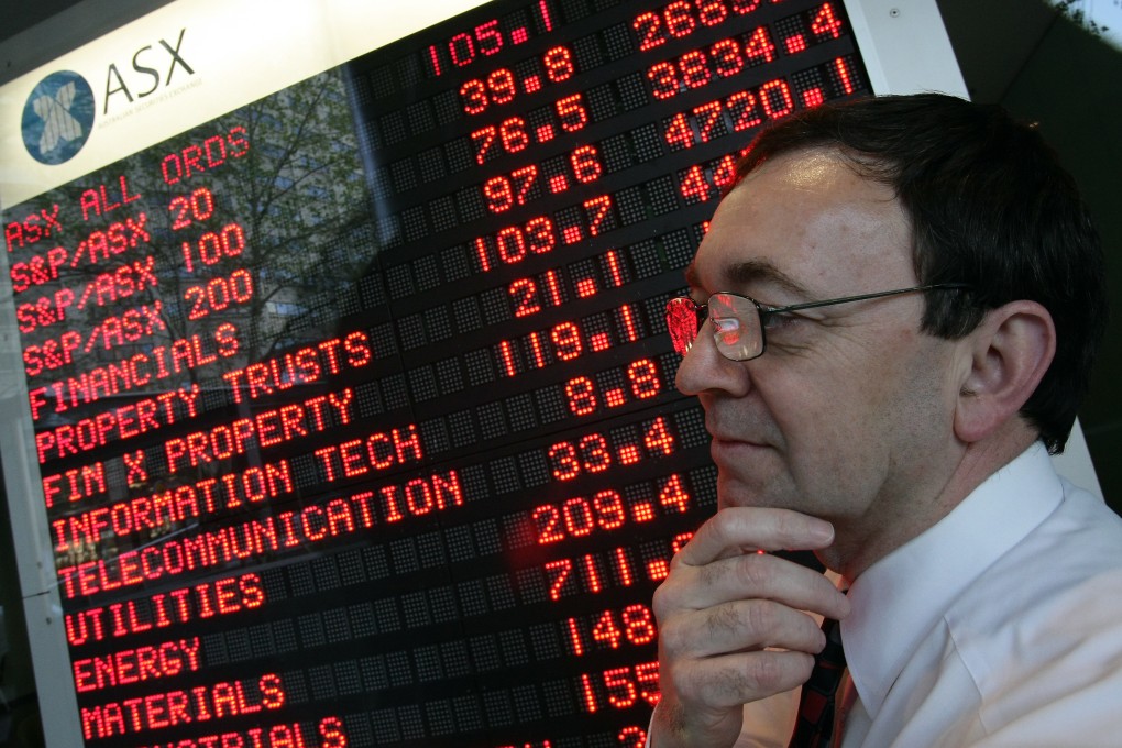 An investor watches the All Ordinaries on the Australia Stock Exchange where the country's sovereign wealth manager, the Future Fund, returned 15.1 per cent for the first nine months of the fiscal year but it warned that future returns may be hard to hit. Photo: AFP