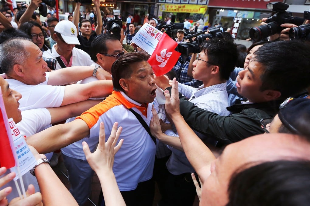 Supporters and opponents of the government 2017 electoral reform plans clash during the government promotion tour. Photo: Sam Tsang