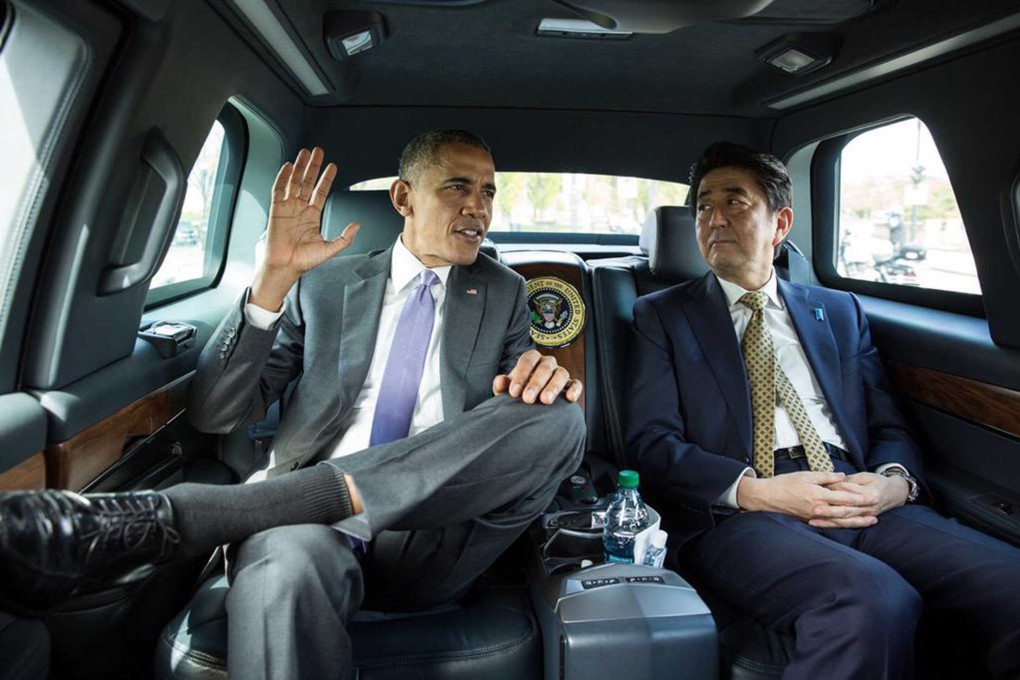 US President Barack Obama (left) and Japanese Prime Minister Shinzo Abe ride together en route to the Lincoln Memorial in Washington yesterday. Photo: Reuters