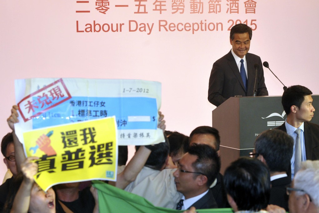 Leung appears to smile during the fracas.Photo: SCMP Pictures