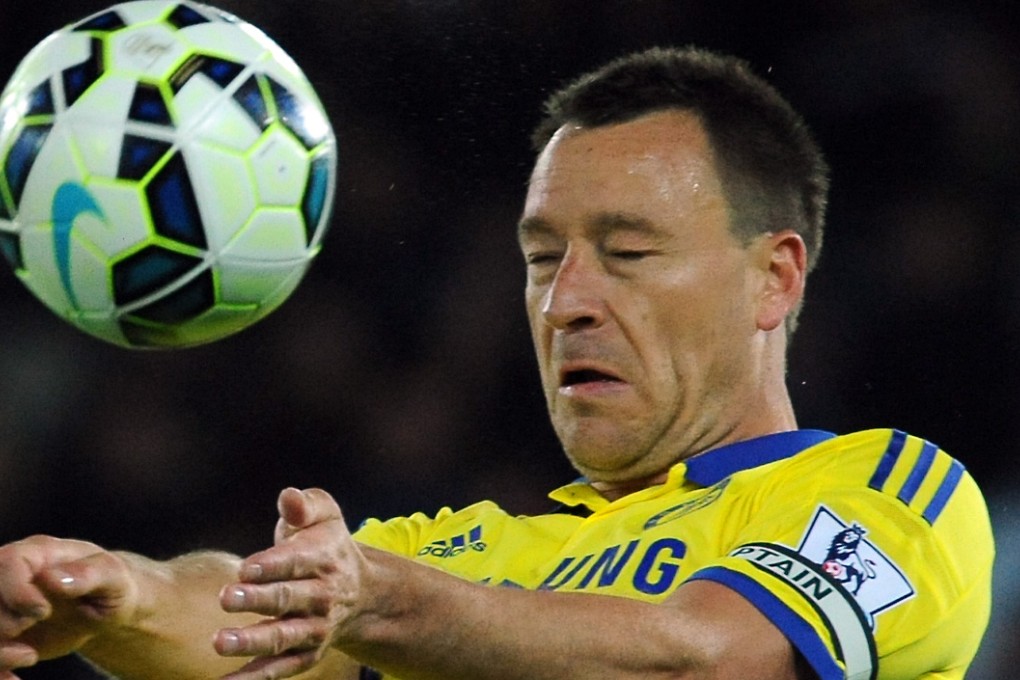 Chelsea's John Terry heads the ball against Leicester City. Photo: AP