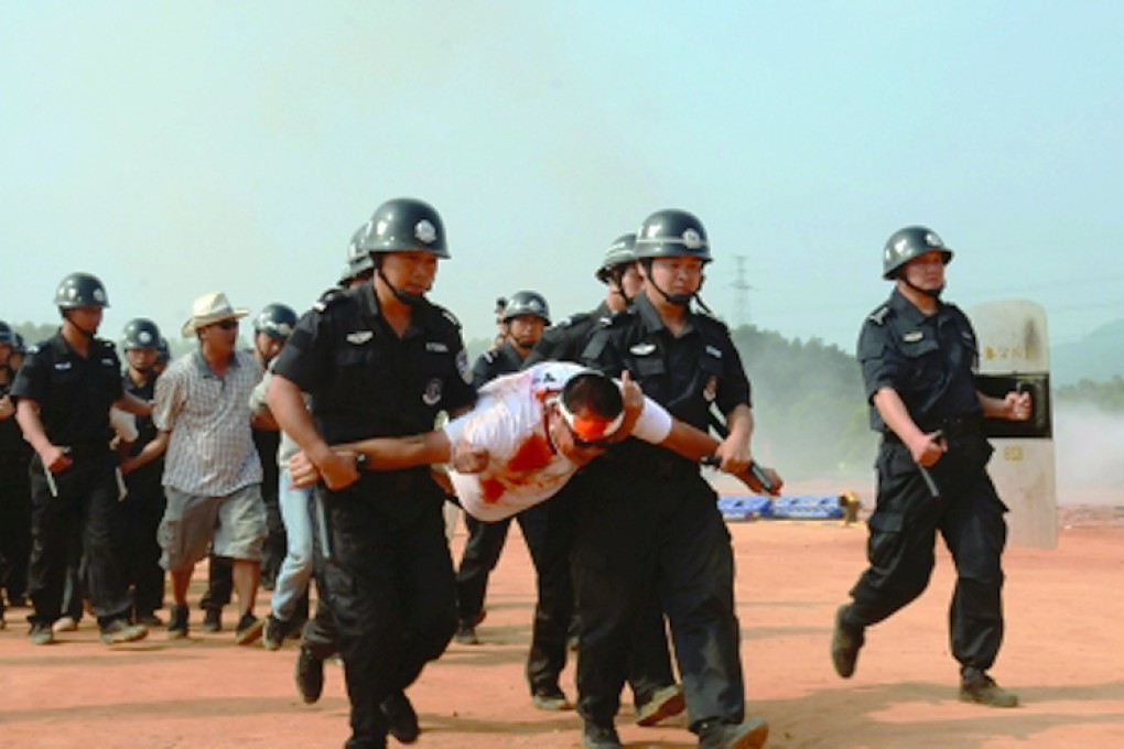 Hundreds of police conducted a variety of 'anti-terrosism' drills in Jiangmen, Guangdong, on Wednesday. Photo: SCMP Pictures