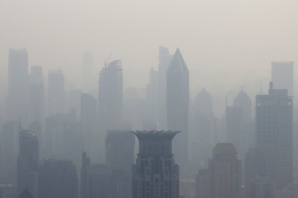 Shanghai buildings shrouded in smog. Photo: Bloomberg