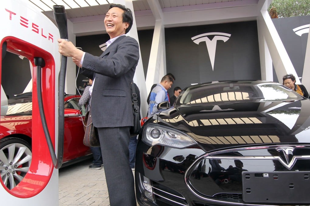 A Tesla "supercharger" in Shanghai pictured on the day of its opening in April 2014. The lack of infrastructure for all electric vehicles is seen as one of the barriers for their greater acceptance in the mainland market. Photo: AFP