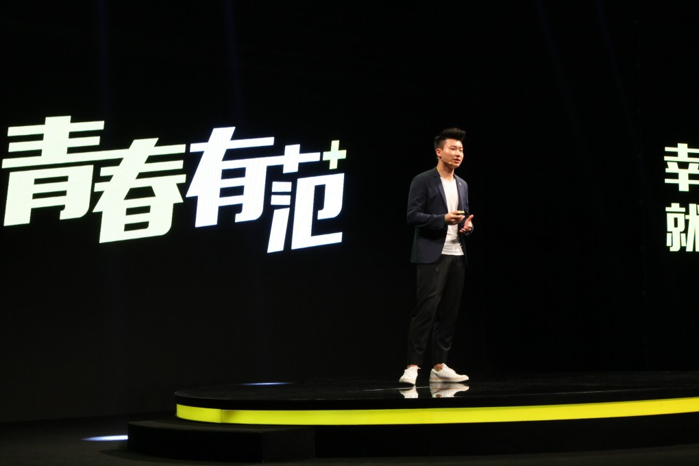 Zhou Bangwei, 18, promoting his business's new app. Photo: SCMP Pictures