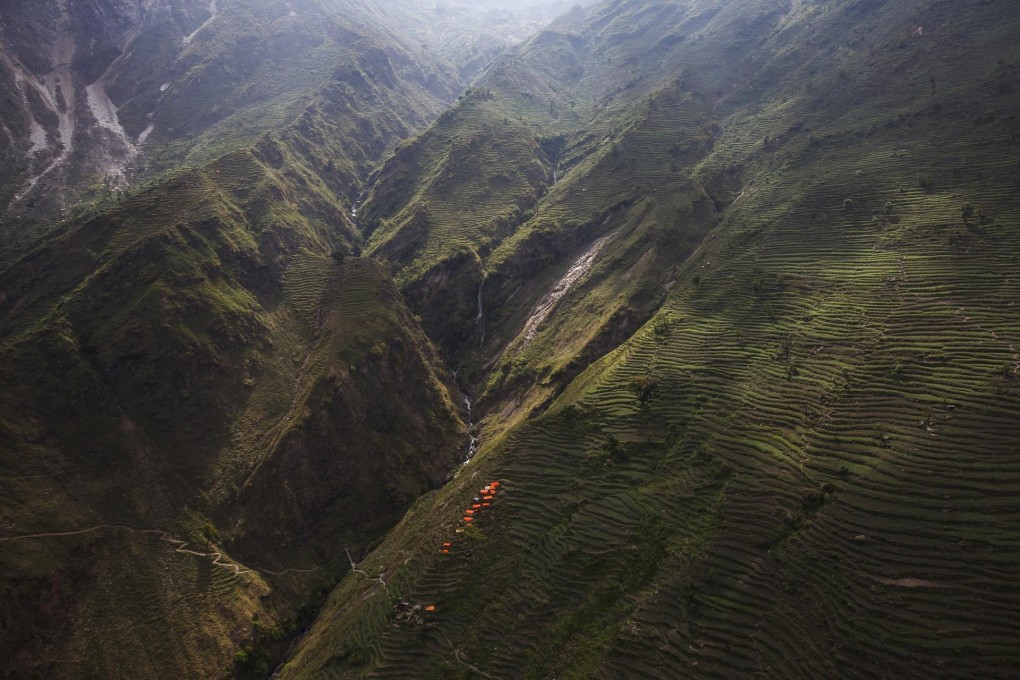 An aerial view shows a group of makeshift shelters near a ruined village in Ghorka. Photo: Reuters