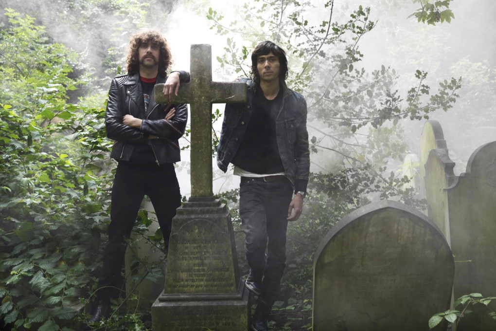 Men on a mission: Xavier de Rosnay (right) with Gaspard Augé, posing with a cross, which serves as Justice's logo.