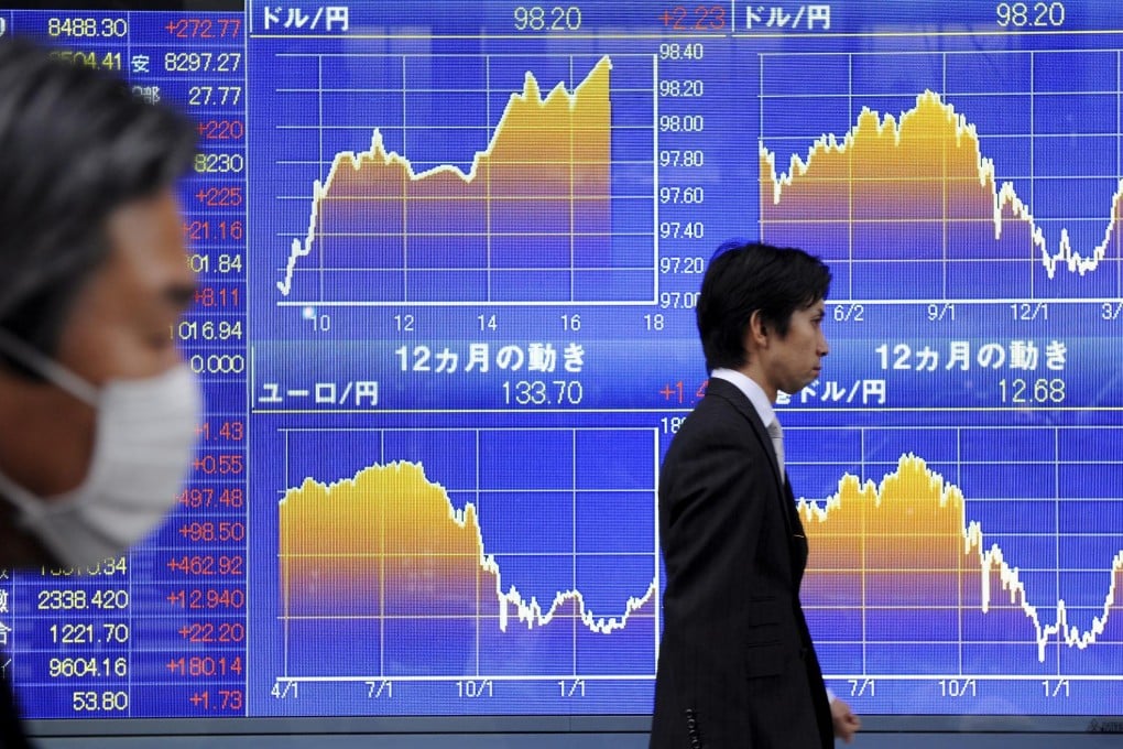Stock indices loom in the background, as market players mull the chances of China's A shares joining the closely watched MSCI index this year or next. Photo: EPA
