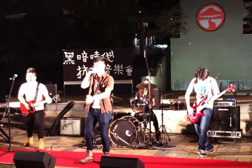 Following the performance, Philip Lau Chun-lam (centre) was warned by the university's president Professor Leonard Cheng Kwok-hon that he could be kicked out if he "damages the university's reputation" again. Photo: Screenshot via Youtube