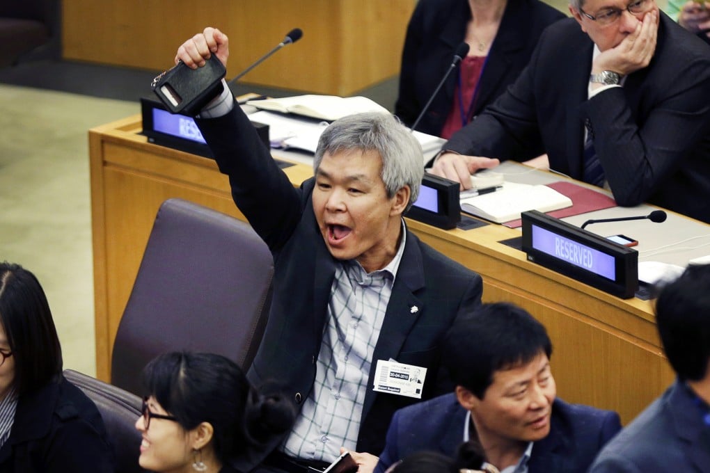 A North Korean defector yells to try and drown out a statement being read by North Korean diplomats during a panel on North Korean human rights abuses at the UN headquarters in New York on Thursday. Photo: AP