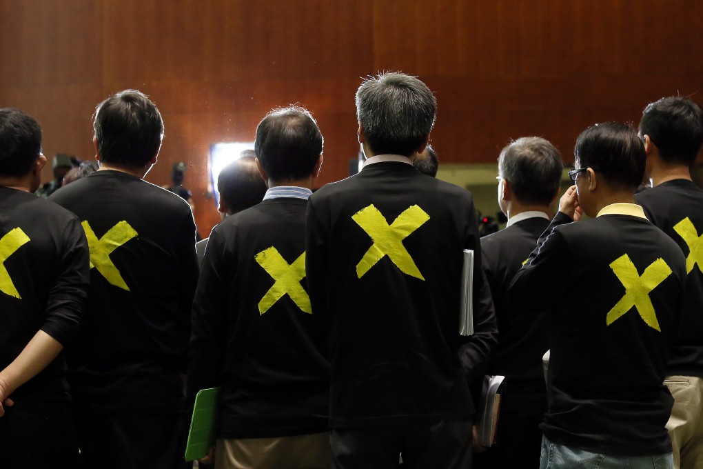 Pan-dems believe they will be stabbed in the back by mild centrists if they veto the reform proposal. Photo:  K.Y. Cheng