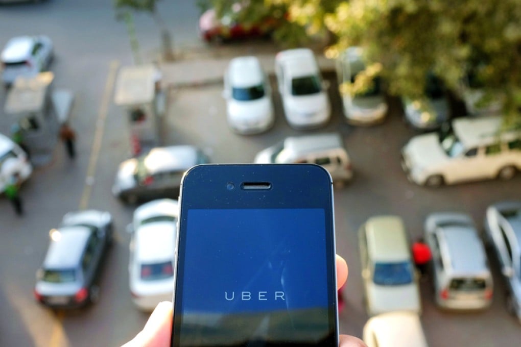 The use of the Uber smartphone app, which books taxis, has faced a number of legal challenges around the world. Photo: AFP