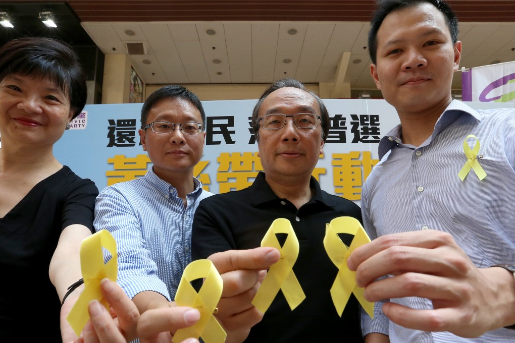 Civic Party's Audrey Eu Yuet-mee, Chan Ka-lok, Alan Leong Kah-kit and Dennis Kwok Wing-hang distribute yellow ribbons to people to call for genuine democracy at Causeway Bay. Photo: K. Y. Cheng