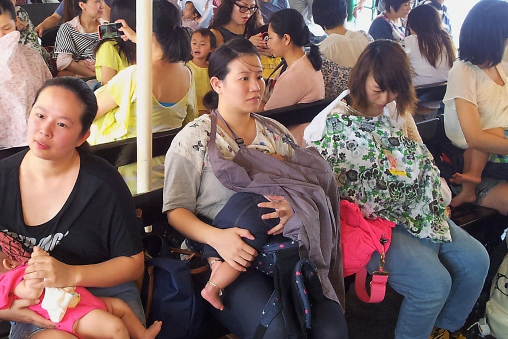 Women breastfeed on a ferry yesterday. Photo: SCMP Pictures