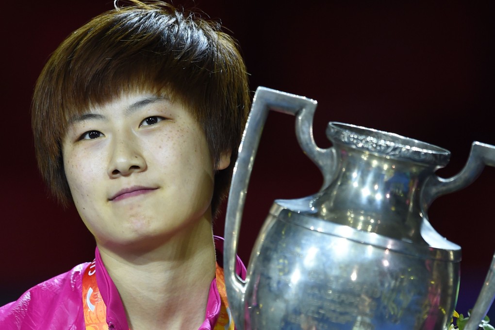 Ding Ning of China poses with her trophy after winning the women's singles final against teammate Liu Shiwen at the World Table Tennis Championships in Suzhou. Photo: AFP